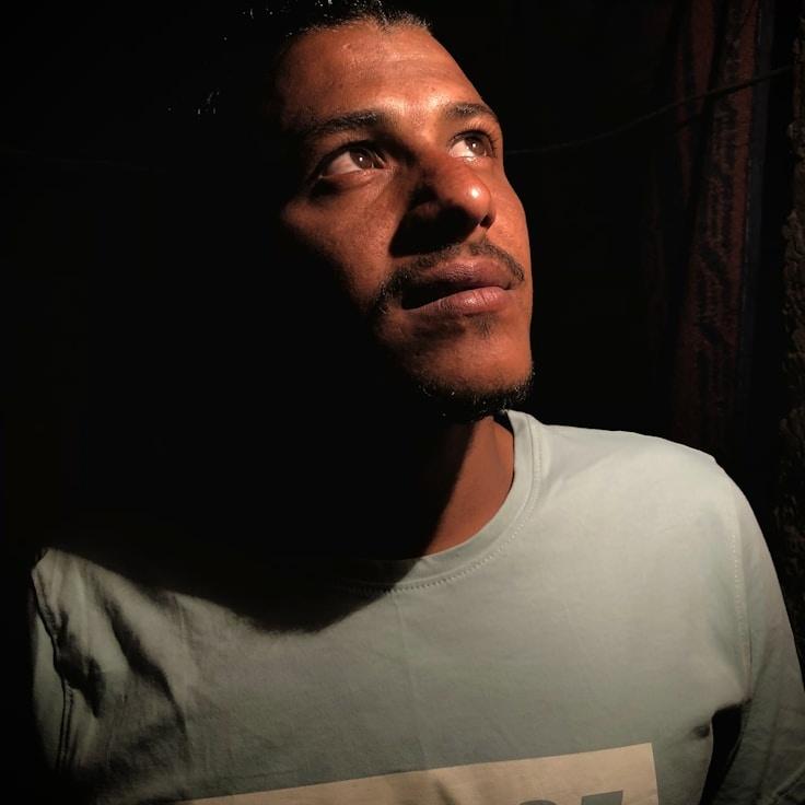 Kaveri Mehta, Lead Design Curator at PlainLightHaven, reviewing corporate floral arrangements